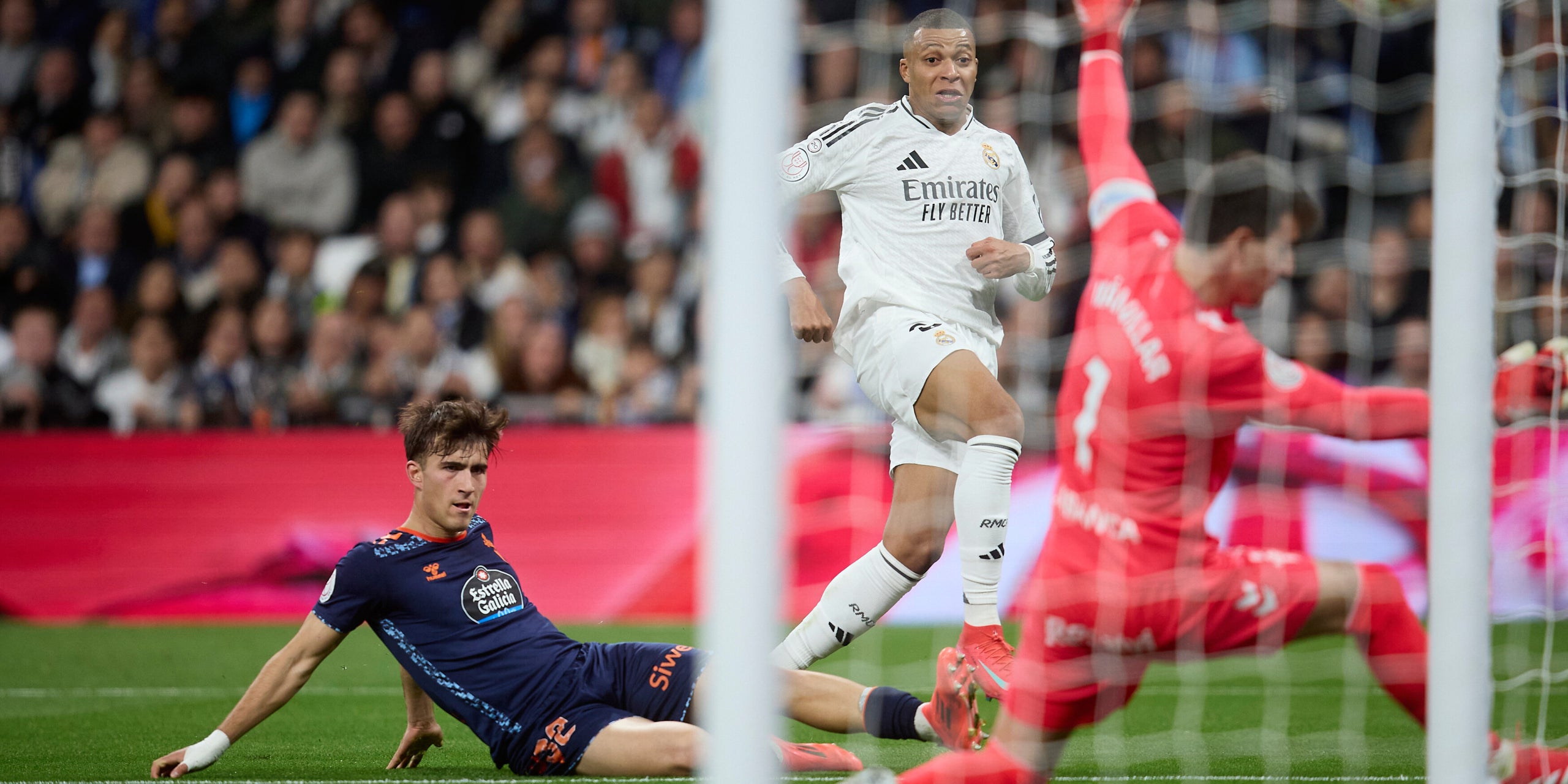16 January 2025, Spain, Madrid: Real Madrid's Kylian Mbappe (C) scores his side's first goal during the Spanish Copa del Rey soccer match between Real Madrid CF and RC Celta de Vigo at Santiago Bernabeu Stadium. Photo: Ruben Albarran/ZUMA Press Wire/dpa
Ruben Albarran/ZUMA Press Wire/d / DPA
16/1/2025 ONLY FOR USE IN SPAIN
