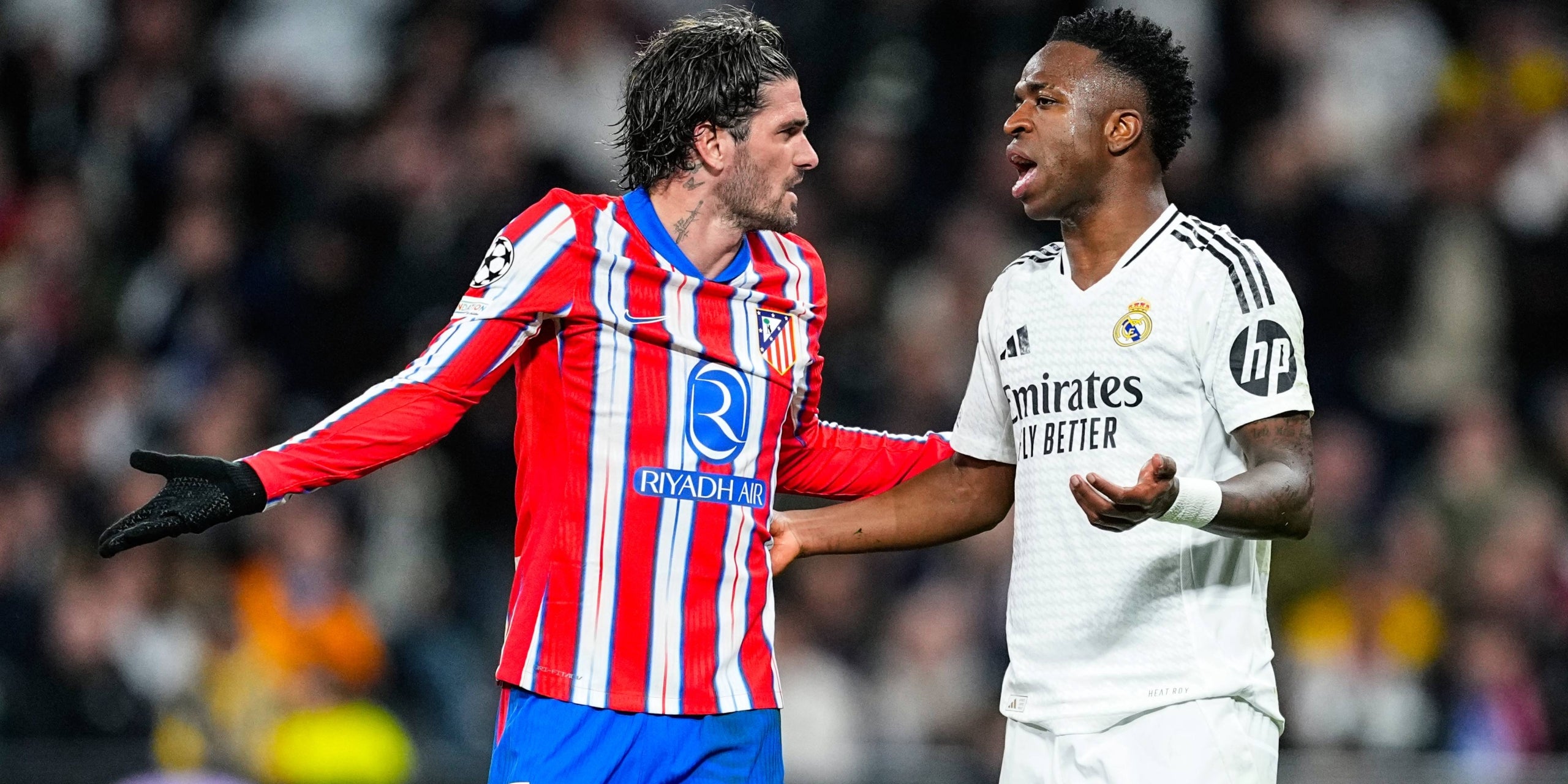 Rodrigo de Paul i Vinicius Jr., durant el derbi madrileny de la Champions | Europa Press
